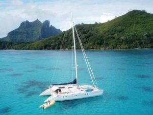 View of Moorea’s jagged mountains from the deck of a sailing catamaran