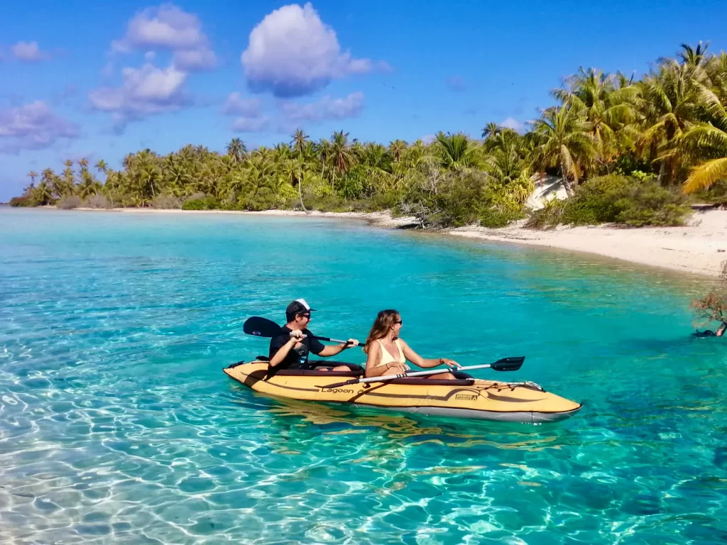 Kayaking between coral gardens in Tuamotu