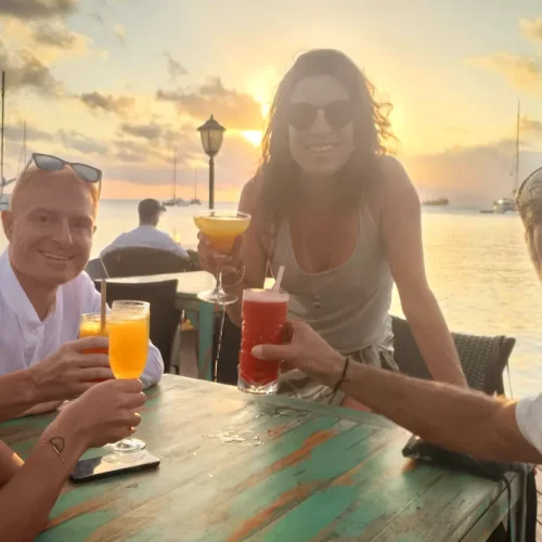 Group enjoying Polynesian-style cocktails on a boat