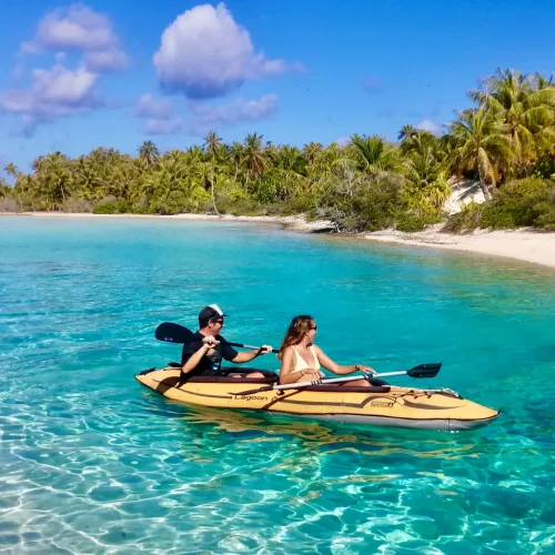 Kayaking between coral gardens in Tuamotu